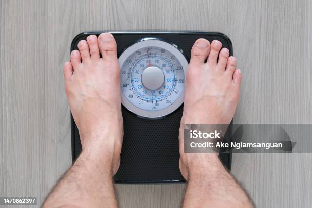 https://media.istockphoto.com/id/1470862397/photo/legs-of-men-standing-on-scales-weight-concept-of-health-and-weight-loss.jpg?s=612x612&w=is&k=20&c=ScUgR9X8wYAiBv1npNBacEvFl7mtU098QWOFHi6VyHA=