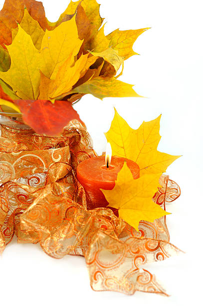 istock fall marple leafs decoration with candle and ribbon 147086602