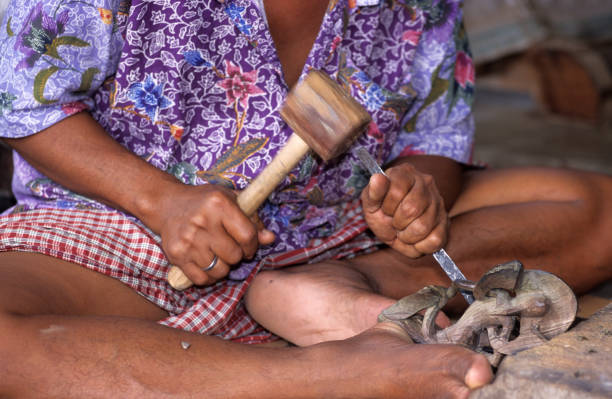 istock Balinese woodcarver 147086685