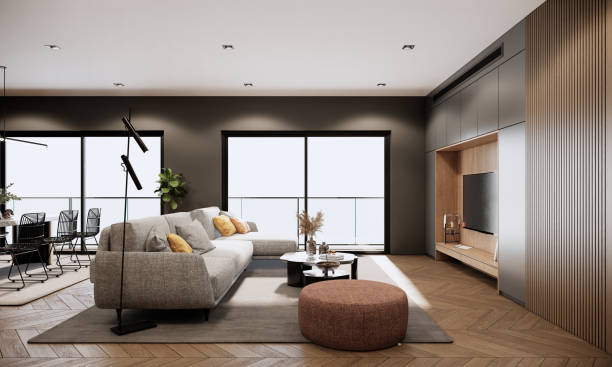 istock Modern room interior design and decoration with fabric sofa round coffee table and orange stool in living room, dining table and black chairs, built in tv, high floor apartment. 3d rendering. 1470867543