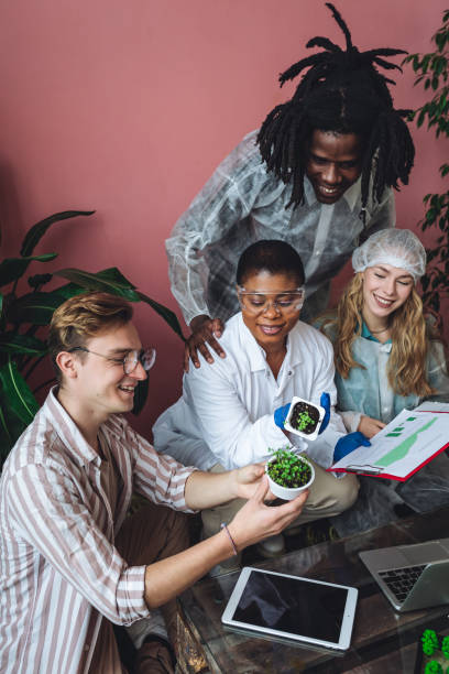 istock International group of diverse multiracial students working on the biological project, creating new species of plants and flowers. Ecological environmental university college study, experiment, test 1470868917