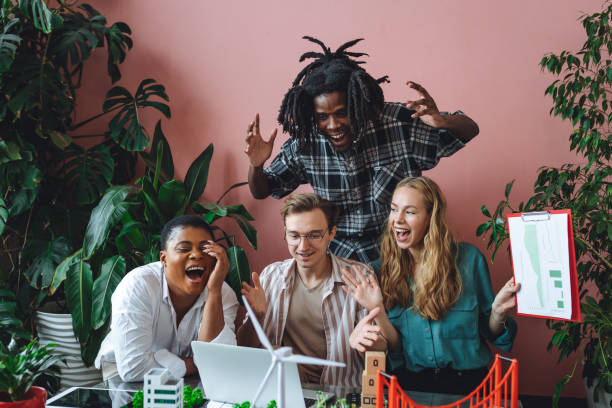 istock International diverse group of students working on modern urban architecture project with renewable green energy source, alternative electricity, waste recycling. Brainstorming ideas, business plan 1470868935