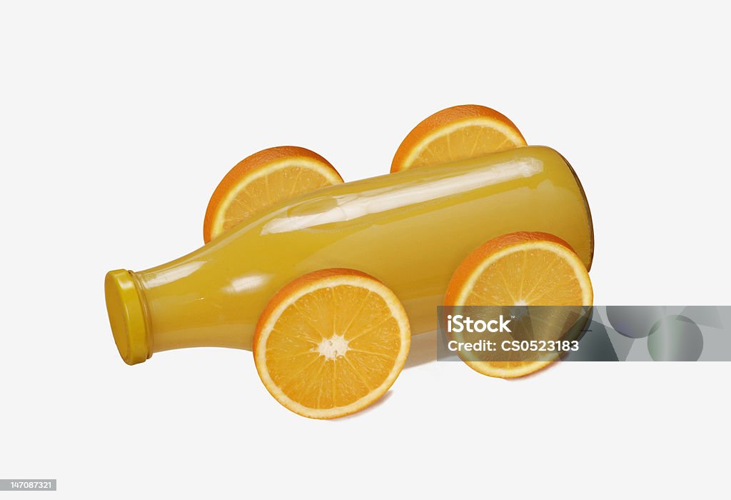 Orange Car. Orange juice botle with wheels. Car Stock Photo