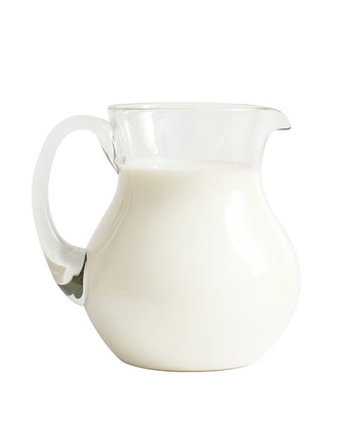 istock Glass jar with milk isolated on white 147087557