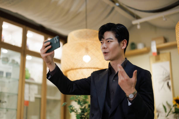 istock businessmen use mobile phone video conference at home 1470875822