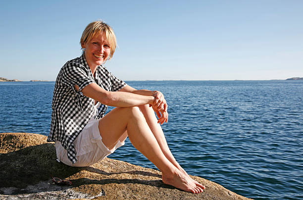 Woman sitting on an island stock photo