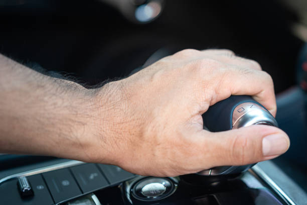 istock Driver shifting the car gear's shifter. 1470879490