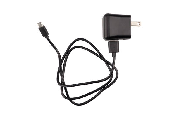 Smartphone charger with USB cable, isolated on white background Smartphone charger with USB cable, isolated on white background mobile phone charger stock pictures, royalty-free photos & images
