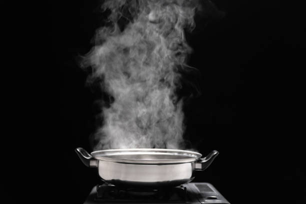 istock Steam over cooking pot in kitchen on dark background. 1470881204