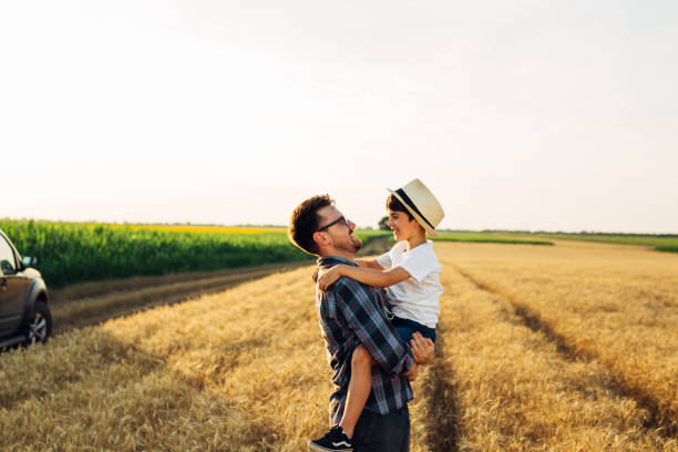 istock father and son outdoor on field 1470882674