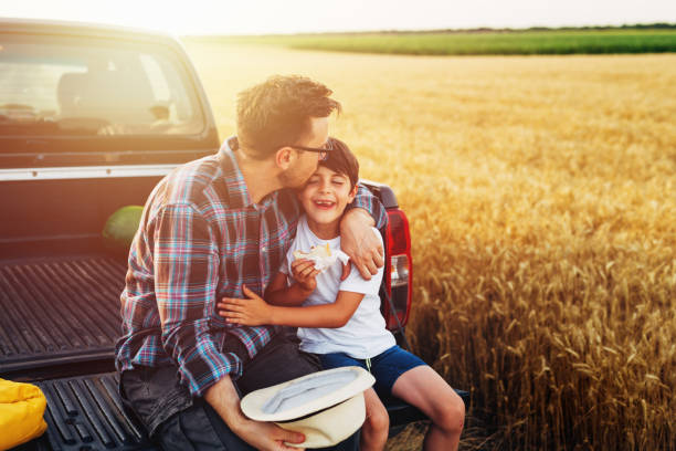 istock father and son outdoor on field 1470882687