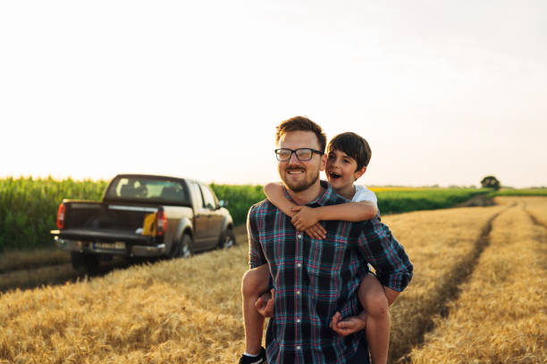 istock father and son outdoor on field 1470882698