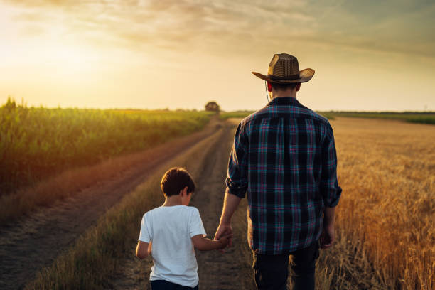 istock father and son outdoor on field 1470882701