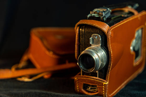 istock Vintage film camera with black background 1470882740
