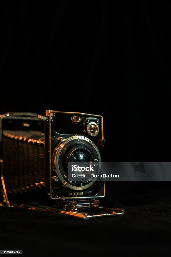 Antique fold photocamera on black background Toronto, Canada. Ancient Stock Photo