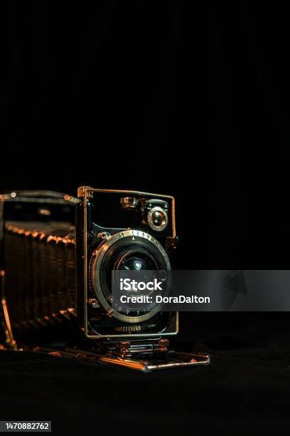 Antique Fold Photocamera On Black Background Stock Photo - Download Image Now - Ancient, Antique, Aperture