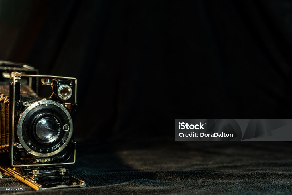 Antique fold photocamera on black background Toronto, Canada. Ancient Stock Photo