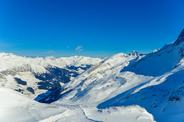 istock Alpine ski resort, mountain peaks covered with snow under the clouds, beautiful mountain landscape 1470883626