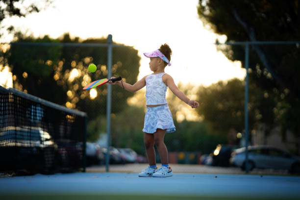 istock Little girl playing pickle ball 1470883990