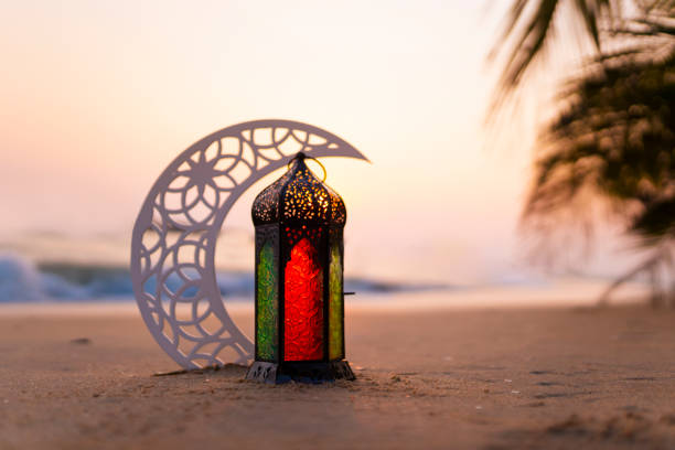 istock Eid Mubarak Lantern with crescent moon on the beach 1470885445
