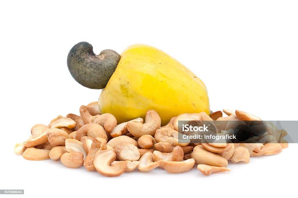 Cashew fruit and nuts Cashew fruit and nuts isolated against a white background Cashew Stock Photo