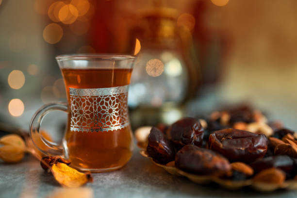 Turkish Tea in a traditional glass with bokeh background, Ramadan and Eid concept image