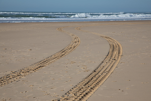beach traces of tyre car in sand coast sea in nature background