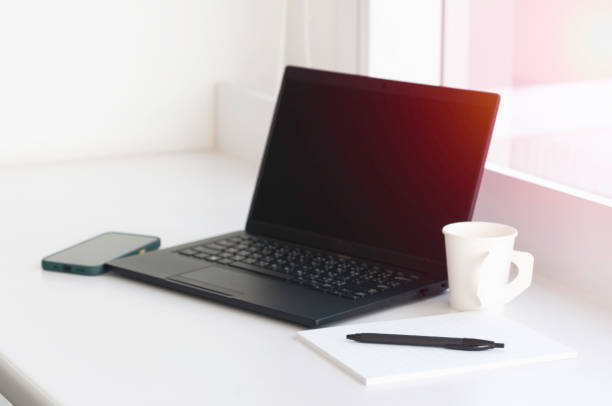istock Single black laptop notepad pen and mobile phone online connected via sharing hotspot ready for meeting and run project, business conception brain strom and get idea for customer. 1470887771