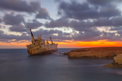Rocky seascape from the island of Cyprus with the shipwreck as main object