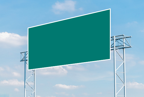Mockup green road sign with blue sky background