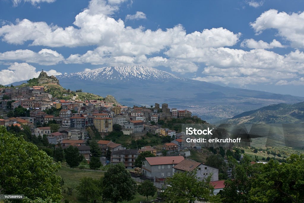 Landscape view of some houses with Mount Etna in background A Small Sicilian village in the shadow of the active volcano, Mt. Etna.  Image taken with a Canon EOS 450D. Active Volcano Stock Photo