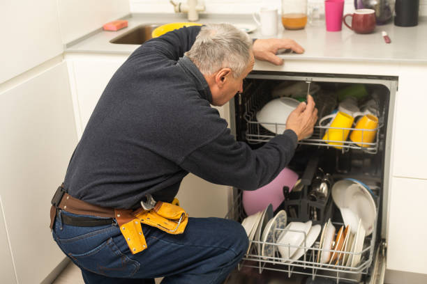 istock Male Technician Sitting Near Dishwasher In Kitchen 1470891816