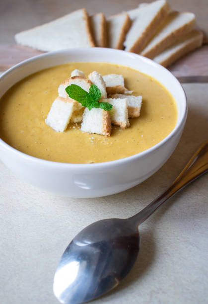 istock Pea soup in a white plate with crackers. lunch. 1470892382