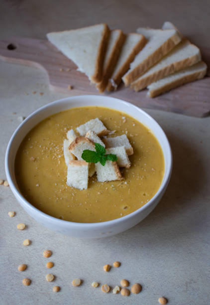 istock Pea soup in a white plate with crackers. lunch. 1470892393