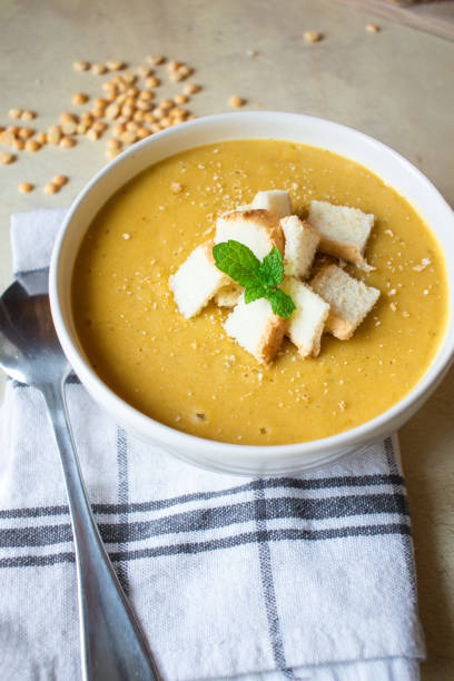 istock Pea soup in a white plate with crackers. lunch. 1470892404