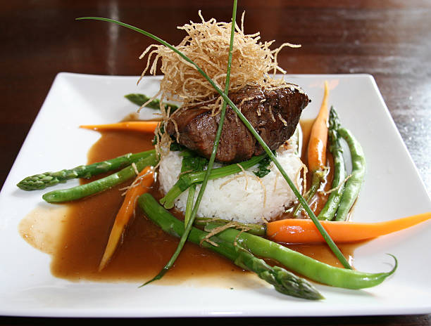 filet mignon Filet mignon served with rice and carrots. trishz stock pictures, royalty-free photos & images