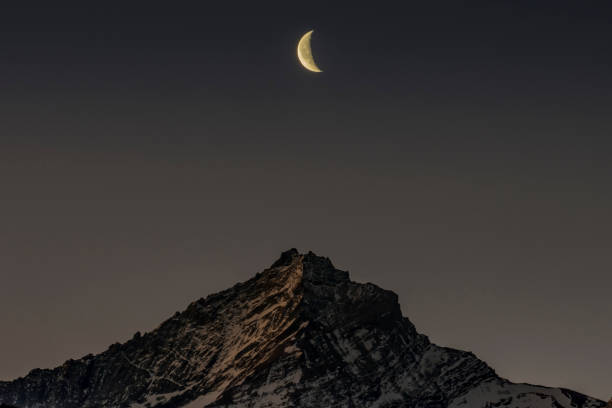 the moon aligns with the mountain - Grivola