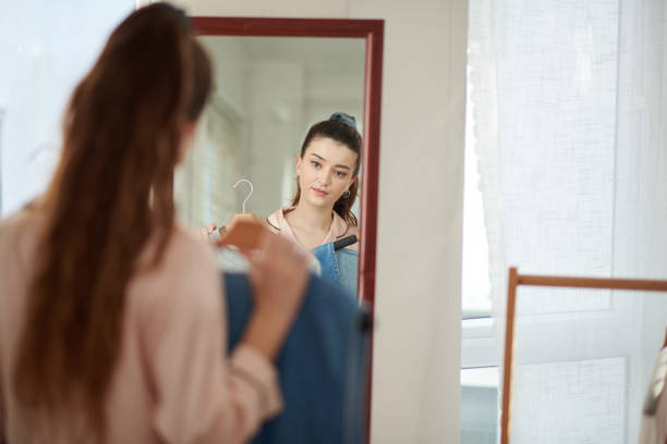 istock Girl Trying on Clothes 1470896644