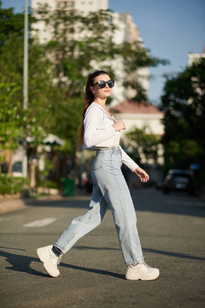 istock Woman Crossing Road 1470896732