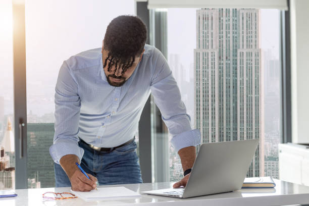 istock Young African businessman working 1470901575