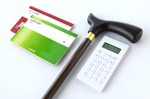 Walking cane and calculator with passbook