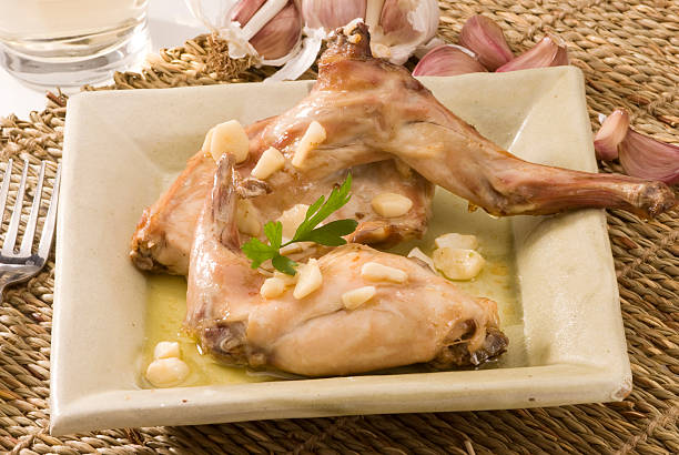 Spanish cuisine. Rabbit in garlic sauce. stock photo