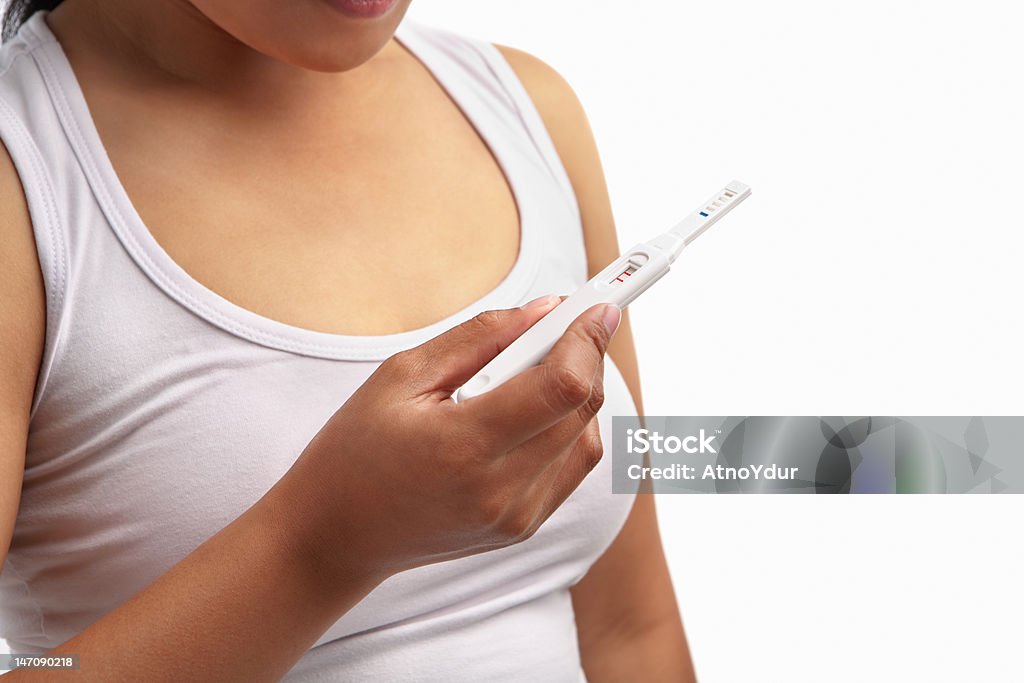 Woman holding pregnancy test woman holding pregnancy test, with positive result Human Hand Stock Photo