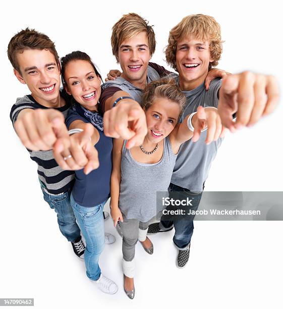 Happy Young Men And Women With Fingers Raised Stock Photo - Download Image Now - Group Of People, Looking At Camera, Team Photo