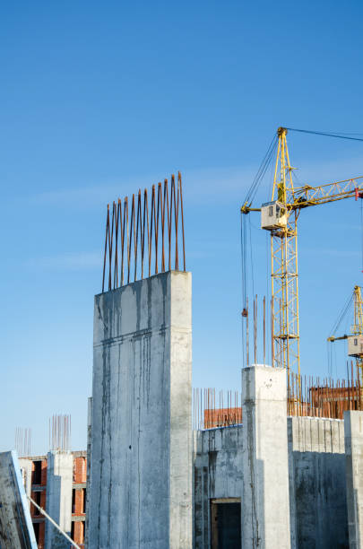 istock crane tower at construction site. Construction of tall buildings. Construction processes. real construction in the city. The construction of skyscrapers. blue sky on the background. 1470904981