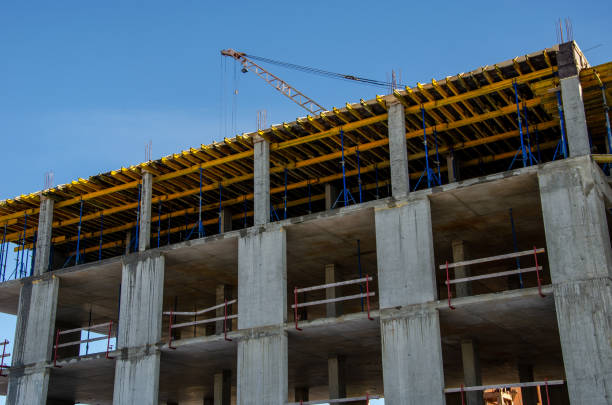 istock Construction site background. Hoisting cranes and new multi-storey buildings. Industrial background. brick building. 1470905026