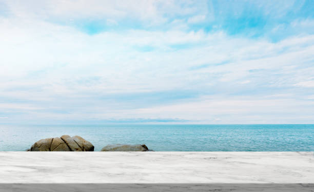 istock Marble texture table top over Sea Beach Ocean with Cloud and Blue Sky,Display Glossy Marble floor on Tropical Sea Beach,Rock stone, Backdrop background with copy space for Summer Product Presentation 1470905484