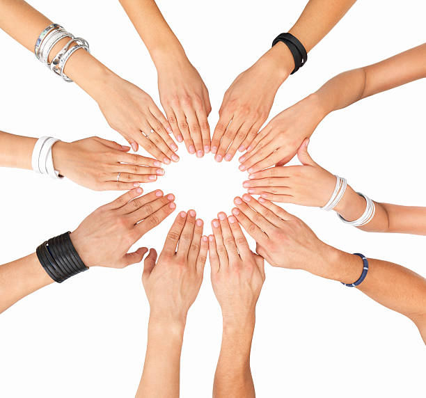 istock Close-up of hands together against white background 147090854