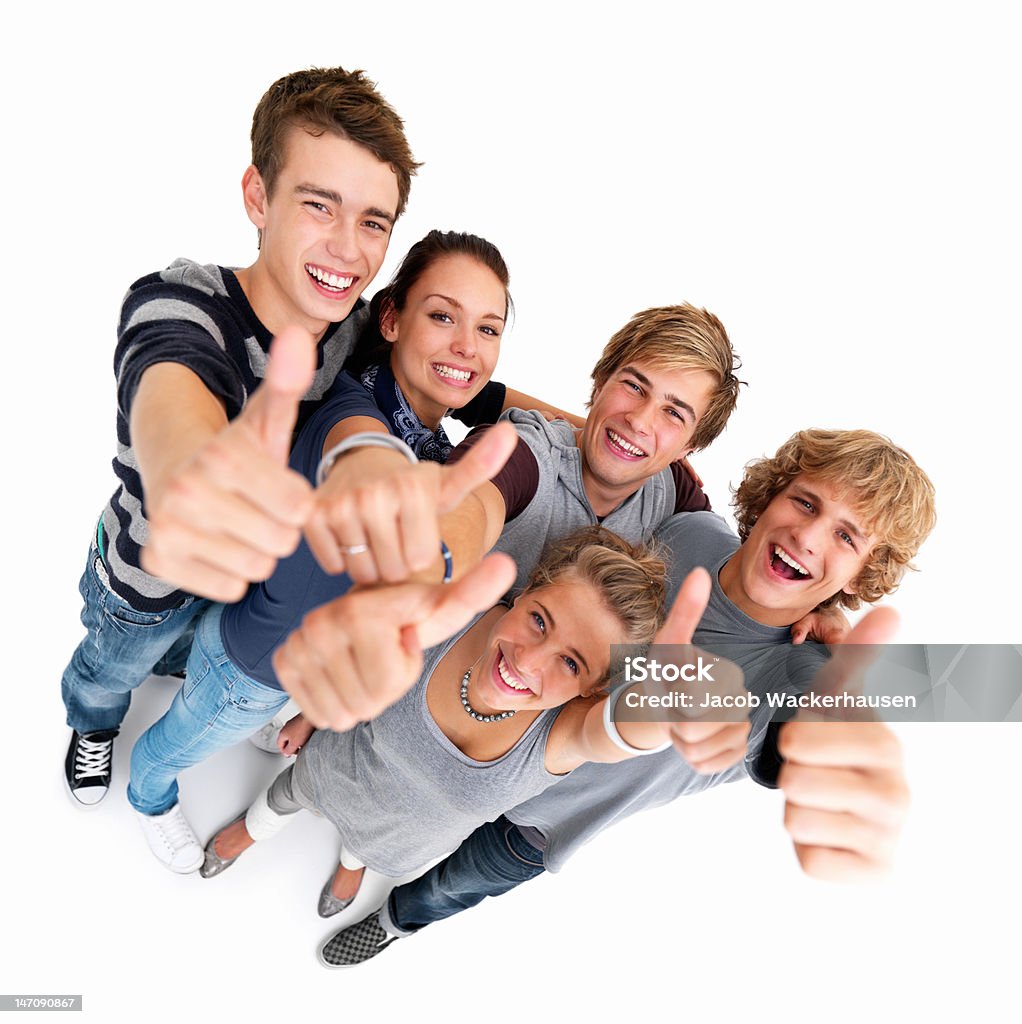Friends showing thumbs up sign 20-24 Years Stock Photo