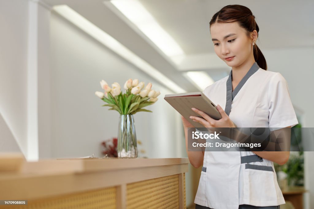 Spa Admin Administrator Checking Schedule Stock Photo - Download Image Now ...